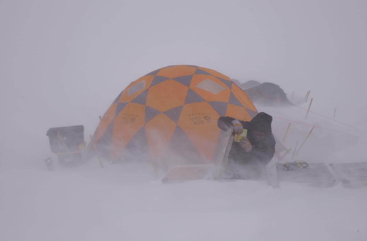 Mike MacFerrin fetching dinner in a storm, southwest Greenland